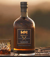 Majestic Monster Whiskey 750 ML single barrel bottle with glass.