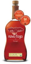 Novo Fogo Tanager Cachaca 84 Proof 750 ML bottle with reddish hue and awards.