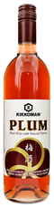 Bottle of Kikkoman Plum Wine 750 ML with glass and fresh plums
